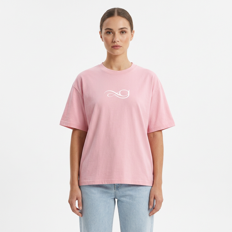 Model wearing the Gather Essential T-Shirt in pink on a white studio background