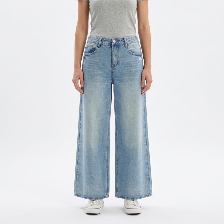 Model wearing Women's Gather Vintage Wash Jeans on a white studio background