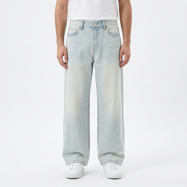 Model wearing Men's Gather Vintage Wash Jeans on a white studio background